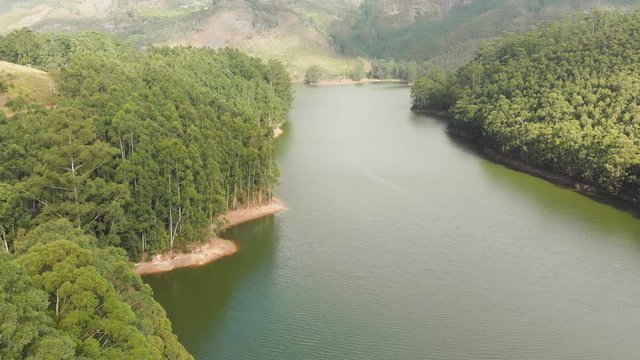 Aerial view beautiful nature with mountains and hills by Lake Mattupetty. Kerala State. Near the city of Munar.