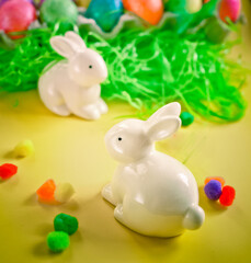 LIttle porcelain Easter Rabbit sitting on the grass/ Symbol of Easter