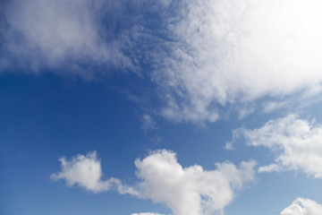 Naklejka na ściany i meble The blue sky with big white clouds