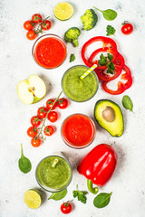 Red and Green vegetable smoothie on white.