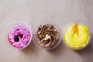 different berry desserts in small cups for self-pickup