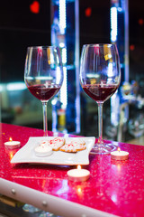 two glasses of wine and heart-shaped cookies. Valentine's Day