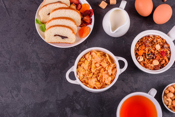 Tasty and useful breakfast with flakes, milk, nuts and dried fruits. The healthy food loading with energy