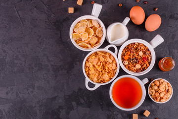 Tasty and useful breakfast with flakes, milk, nuts and dried fruits. The healthy food loading with energy