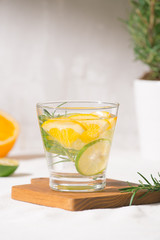 Fototapeta na wymiar Fresh summer lemonade with citrus, orange and rosemary