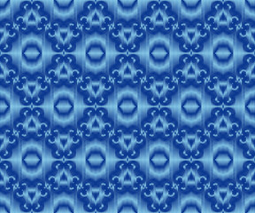 Indigo dyed ikat seamless pattern. Original patterned fabric texture.