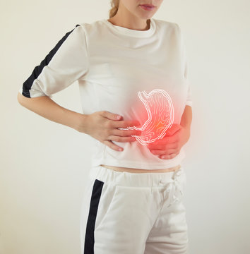 Digital composite of highlighted stomach of woman
