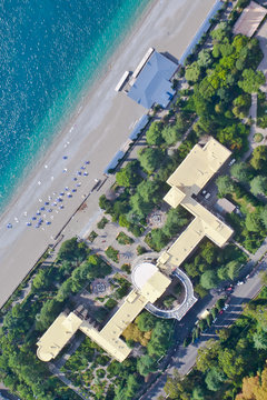 Top-down view beautiful hotels by the sea in a green forest (aerial photo from a paraglider), summer holidays in the Caucasus in Abkhazia