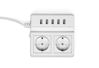 White power socket with USB on a wall. Isolated