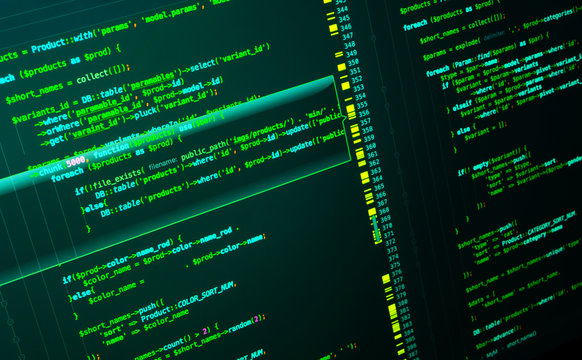 Web developing of the site using php language. Code on dark green background, macro