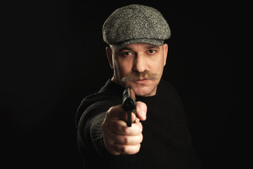 man pointing a gun at the camera