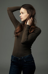 Fototapeta premium Pretty brunette woman with long hair looking away