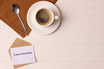  cup of coffee on wooden background top view. Good morning! Have a nice day