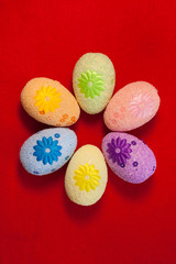 Decorative eggs on red background . Concepts Easter, eggs, hand made,