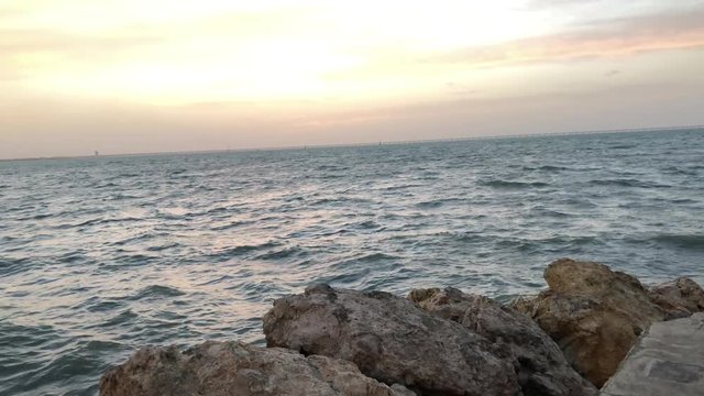 The sky of Kuwait on the sea at sunset. And the atmosphere where the air and rain at night after filming.  Photographed in : 1/4/2019