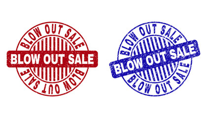 Grunge BLOW OUT SALE round stamp seals isolated on a white background. Round seals with grunge texture in red and blue colors.