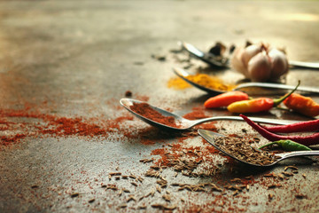 Spoons with different spices