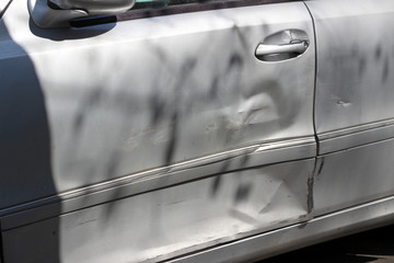 Smashed damaged gray grey car driver door wreck accident