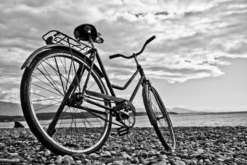 Obraz premium vintage bicycle by the sea. Monochrome (black and white). Tourism i in Abkhazia.