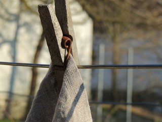 Vintage old wooden cloth pin and natural linen towel