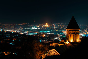 Georgia, Tbilisi - 05.02.2019. - Night panorama aerial view over Georgian capital main landmarks - Night image © predragmilos