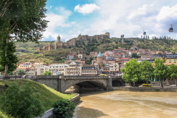 Naklejka premium Walking in Tbilisi. Bridges over the Kura river in the Georgian capital