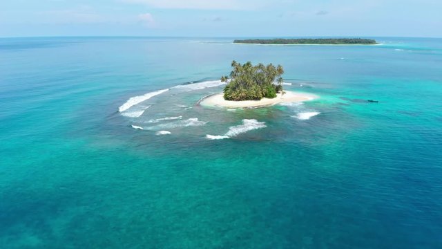 Aerial: flying over desert island tropical beach caribbean sea coral reef sunset sky. Indonesia Sumatra Banyak islands travel destination