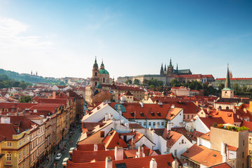 Fototapeta na wymiar View of Prague rooftops, St. Vitus Cathedral and St. Nicholas Cathedral. Czech republic