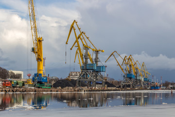 Fototapeta na wymiar The city's port in Vyborg. Yellow port cranes