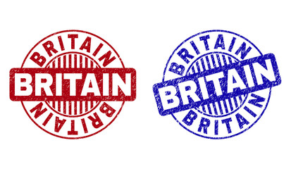 Grunge BRITAIN round stamp seals isolated on a white background. Round seals with grunge texture in red and blue colors. Vector rubber overlay of BRITAIN title inside circle form with stripes.