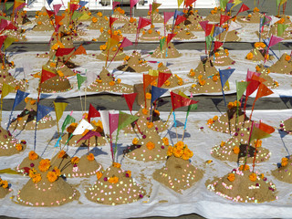 Sand pagodas. Songkran day(Thai new year) people carrying sand to temple and forming sand pagodas