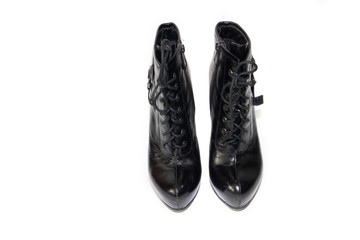 Female black ankle boots with heels isolated on white background. Shoes on a white background. Black shoes Women's shoes.