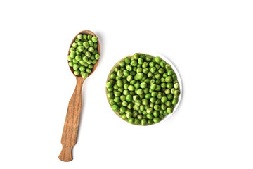 Green peas in a white bowl and in a wooden spoon isolated on white background.