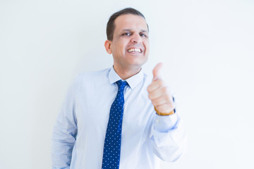 Middle age man doing postive gesture with thumbs up smiling to the camera