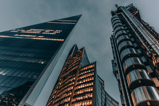 Modern Business Buildings With Lights In City Of London Finance District Skyline