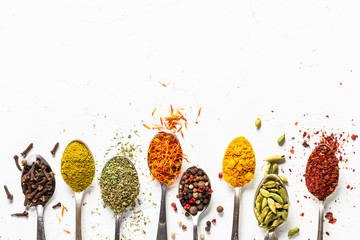 Set of indian spices in spoons on white © nadianb
