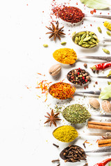 Set of indian spices in spoons on white © nadianb