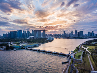 Drone aerial picture of the skyline of Marina Bay in Singapore during sunset