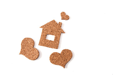 house with hearts around of cork on white background