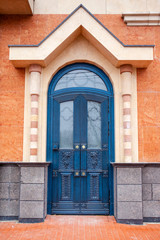 Fototapeta na wymiar massive wooden blue door