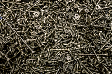 a lot of screws of various sizes close up
