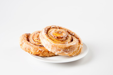 cinnamon buns on white background