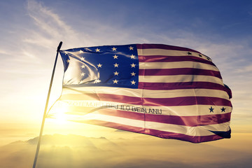 Bikini Atoll flag waving on the top sunrise mist fog