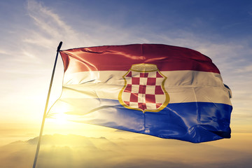 Croatian Republic of Herzeg-Bosnia flag waving on the top sunrise mist fog