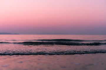 Tropical nature clean beach and white sand in summer with sun light blue sky and bokeh background.