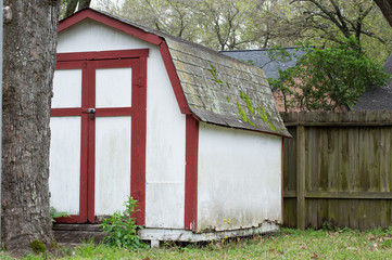 Fototapeta na wymiar Red and white shed in the backyard