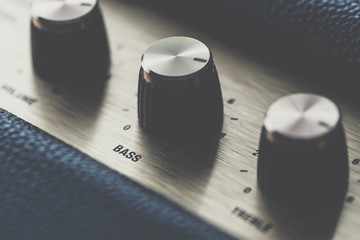 Bass control knob on music amplifier