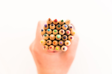 multi-colored pencils for drawing children in school and kindergartens on a white background