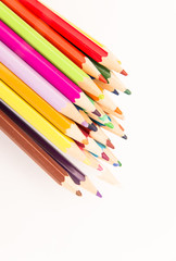 multi-colored pencils for drawing children in school and kindergartens on a white background