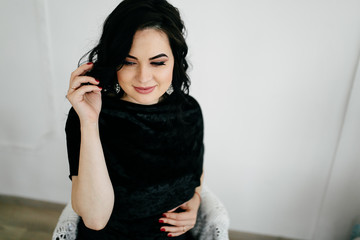 Fototapeta premium Portrait of a elegant beautiful pregnant woman